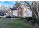 Charming two-story home featuring a brick and stucco facade, well-maintained landscaping, and a welcoming front entrance at 3920 Vine Gate Dr, Lithonia, GA 30038
