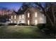 Charming two-story home featuring a brick and stucco facade, well-maintained landscaping, and a welcoming front entrance at 3920 Vine Gate Dr, Lithonia, GA 30038