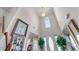 Grand foyer with high ceilings, a chandelier, and lots of natural light streaming through an arched window at 3920 Vine Gate Dr, Lithonia, GA 30038