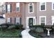Inviting front entrance with a garden-lined walkway leading to the home's front door and manicured landscaping at 3920 Vine Gate Dr, Lithonia, GA 30038