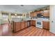 Spacious kitchen featuring updated cabinets, stainless steel appliances, and a bright breakfast nook at 3920 Vine Gate Dr, Lithonia, GA 30038