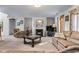 Inviting living room featuring a fireplace, plush seating, and plenty of natural light creating a comfortable and cozy space at 3920 Vine Gate Dr, Lithonia, GA 30038