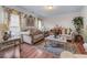 Cozy living room featuring elegant decor, plush seating, and natural light creating a warm and inviting atmosphere at 3920 Vine Gate Dr, Lithonia, GA 30038