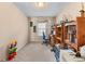 Home office with large desk area, bookshelves, and natural light from the window at 3920 Vine Gate Dr, Lithonia, GA 30038