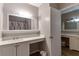 Well-lit bathroom featuring dual vanities, generous counter space, and framed mirrors at 922 Lakewood Ln, Jonesboro, GA 30238