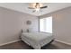 Cozy bedroom featuring a ceiling fan and a large window, creating a relaxing and well-lit space at 922 Lakewood Ln, Jonesboro, GA 30238