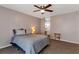 Comfortable bedroom features soft carpet, a ceiling fan, and an en-suite bathroom at 922 Lakewood Ln, Jonesboro, GA 30238