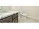 Bathroom featuring a granite countertop vanity and a tiled floor at 211 Lotus Ln, Covington, GA 30016