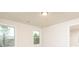 Bright bedroom with two windows offering natural light and neutral walls at 211 Lotus Ln, Covington, GA 30016