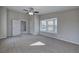 Spacious bedroom featuring a ceiling fan, neutral walls, plush carpet, and a bay window at 58 Knox Rd, Powder Springs, GA 30127