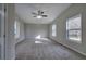 Bedroom with large windows, neutral tones, and a ceiling fan at 58 Knox Rd, Powder Springs, GA 30127