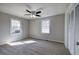 This comfortable bedroom has carpet, two windows, ceiling fan and a closet at 58 Knox Rd, Powder Springs, GA 30127