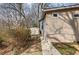 Side view of home with light siding next to a storage shed, highlighting the property's practical outdoor storage at 58 Knox Rd, Powder Springs, GA 30127