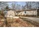 Charming single-story home with light beige siding and a welcoming front entrance with small wood stairs at 58 Knox Rd, Powder Springs, GA 30127