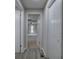 Hallway features hardwood floors and a view into an adjacent room at 58 Knox Rd, Powder Springs, GA 30127