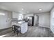 Bright kitchen with stainless steel appliances, an island with seating and wood-look flooring at 58 Knox Rd, Powder Springs, GA 30127
