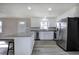 Bright kitchen featuring stainless steel appliances, granite countertops and a center island with seating at 58 Knox Rd, Powder Springs, GA 30127