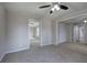 Spacious living room with view to other rooms, carpet flooring, and ceiling fan at 58 Knox Rd, Powder Springs, GA 30127