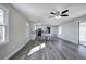 Open-concept living room into the kitchen features hardwood floors and natural light at 58 Knox Rd, Powder Springs, GA 30127