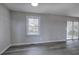 Spacious room features a window and sliding glass door for ample natural light at 58 Knox Rd, Powder Springs, GA 30127