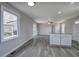 Large room featuring a window, sliding glass door, and a kitchen island at 58 Knox Rd, Powder Springs, GA 30127
