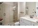 Modern bathroom featuring a glass-enclosed shower with tiled walls and a sleek vanity, offering a spa-like experience at 6180 Bellmoore Park Ln, Duluth, GA 30097