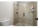 Modern bathroom featuring a glass-enclosed shower with tiled walls, providing a sleek and functional design at 6180 Bellmoore Park Ln, Duluth, GA 30097