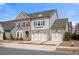 Beautiful two-story home featuring brick and siding, two-car garage, and well-manicured landscaping at 6180 Bellmoore Park Ln, Duluth, GA 30097