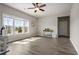 Bright room with hardwood floors, large windows, and natural light, creating a welcoming and versatile living space at 6180 Bellmoore Park Ln, Duluth, GA 30097