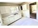 Bright kitchen with white cabinets, double sink, and ample counter space at 2075 Dellwood Pl, Decatur, GA 30032
