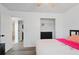 Bedroom features wood-look floors and a view into the bathroom and walk-in closet at 3644 Gray Birch Dr, Decatur, GA 30034