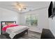 Bedroom with a ceiling fan, good natural light, and wood-look flooring at 3644 Gray Birch Dr, Decatur, GA 30034
