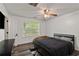 Bedroom with a ceiling fan and wood-look flooring at 3644 Gray Birch Dr, Decatur, GA 30034
