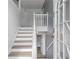 Light and airy entryway with stairway featuring white risers and wood-look treads at 3644 Gray Birch Dr, Decatur, GA 30034