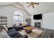 Bright living room features a fireplace, vaulted ceilings, and large windows offering abundant natural light at 3644 Gray Birch Dr, Decatur, GA 30034