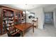 Inviting dining area showcases a wood table set adjacent to a wall of built-in bookcases, offering ample storage at 1804 Cumberland Se Ct, Smyrna, GA 30080