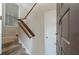 Inviting entryway features a staircase with wood railing leading upstairs and a warm door with decorative hardware at 1804 Cumberland Se Ct, Smyrna, GA 30080