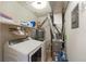 Functional laundry room includes a washer, dryer, and storage shelves, streamlining household chores at 1804 Cumberland Se Ct, Smyrna, GA 30080