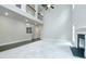 Spacious living room with soaring ceilings, cozy fireplace, hardwood floors, new carpet, and abundant natural light at 3118 Old Covington Hwy, Covington, GA 30014