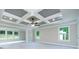 Primary bedroom features a tray ceiling, a fan, and large windows providing ample natural light, new carpet and neutral walls at 3118 Old Covington Hwy, Covington, GA 30014