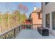 Spacious back deck overlooking wooded area provides space for relaxation and outdoor living at 5732 Ashleigh Walk Dr, Suwanee, GA 30024