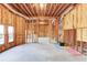 Spacious unfinished basement with exposed insulation and framing, offering numerous possibilities for customization at 5732 Ashleigh Walk Dr, Suwanee, GA 30024