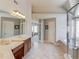 Spacious bathroom with double vanity, soaking tub, and glass-enclosed shower, providing a luxurious retreat at 5732 Ashleigh Walk Dr, Suwanee, GA 30024