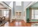 Elegant foyer featuring gleaming hardwood floors, tall ceilings, and stylish trim, creating a welcoming entrance at 5732 Ashleigh Walk Dr, Suwanee, GA 30024