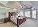Spacious main bedroom featuring a trey ceiling, carpet, and natural light at 5732 Ashleigh Walk Dr, Suwanee, GA 30024