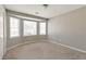 Bedroom with neutral carpet and a bank of windows providing natural light at 600 Canterbury Ln, Lawrenceville, GA 30046
