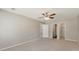 Spacious bedroom with neutral carpet, ceiling fan, and closet at 600 Canterbury Ln, Lawrenceville, GA 30046