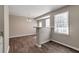 Open concept dining room and breakfast bar featuring wood-look flooring and natural light at 600 Canterbury Ln, Lawrenceville, GA 30046