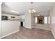 Open-concept dining area connects the kitchen and living room, featuring modern finishes and ample lighting at 600 Canterbury Ln, Lawrenceville, GA 30046
