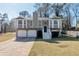 Charming two-story home featuring a two-car garage and inviting front porch with nice landscaping at 600 Canterbury Ln, Lawrenceville, GA 30046